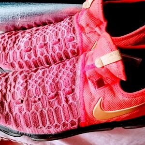 Nike Red and Orange Sneakers with Geometric Mesh Design